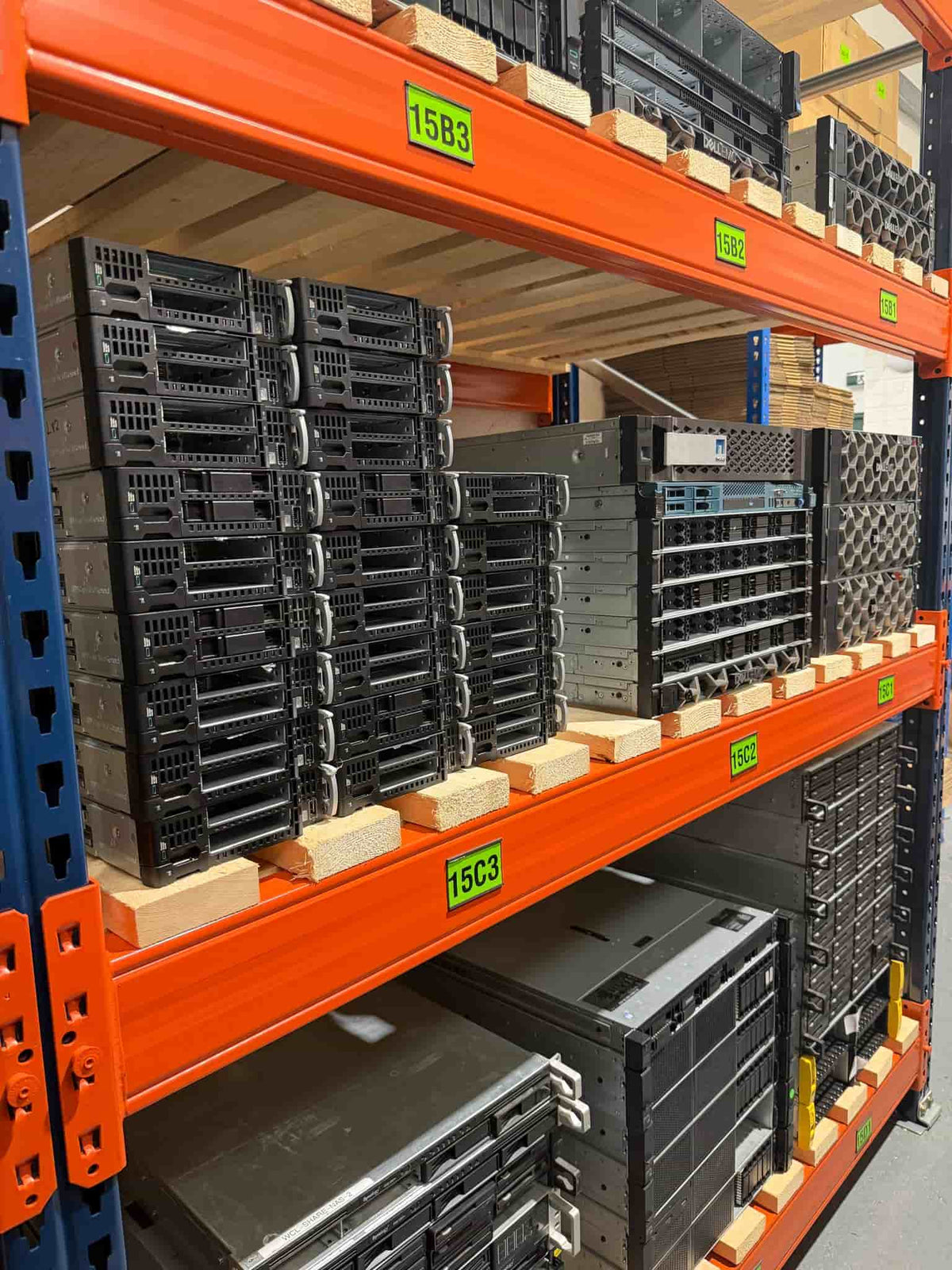 Refurbished servers and IT equipment stored on warehouse shelving at Kortek's processing facility